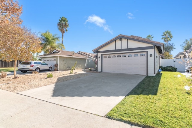 ranch-style house featuring a garage and a front lawn