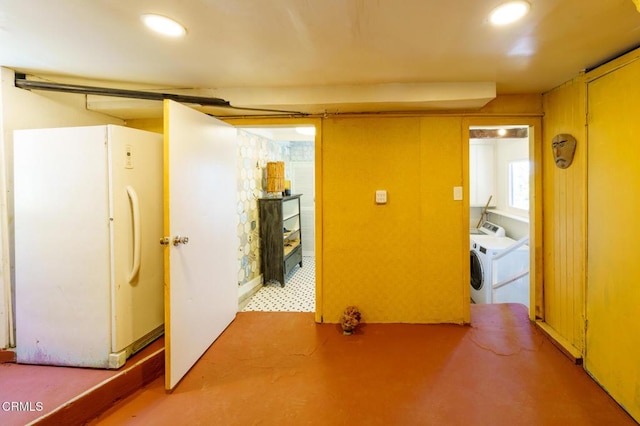 hallway with washer and clothes dryer