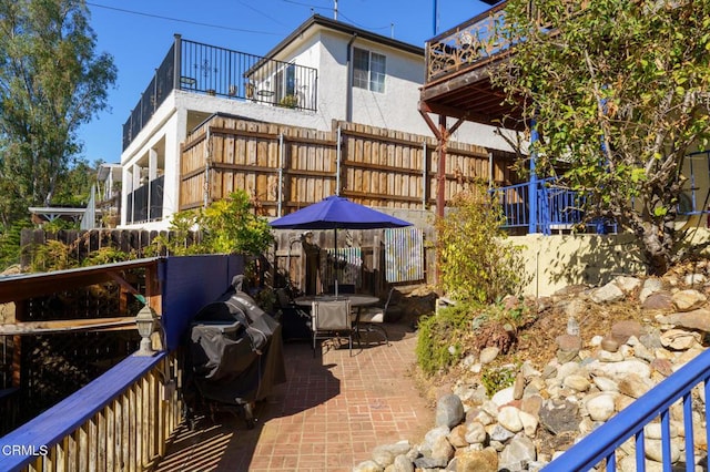 exterior space with a grill and a patio area