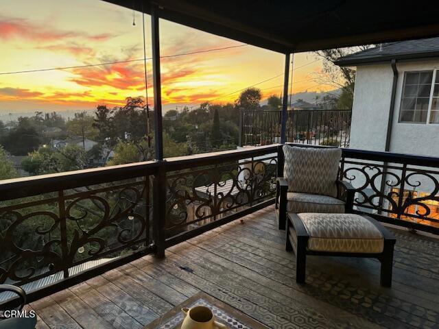 view of balcony at dusk