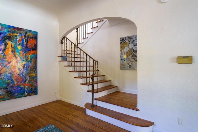 staircase featuring hardwood / wood-style floors