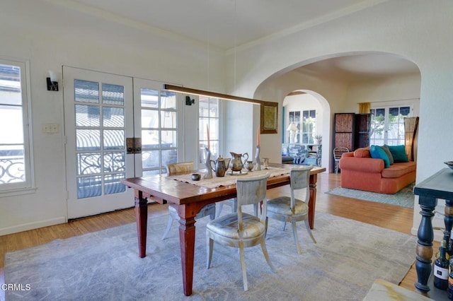 dining room featuring light hardwood / wood-style flooring and french doors