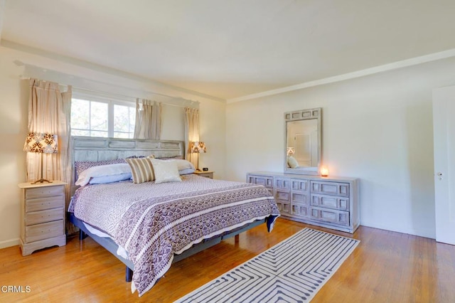 bedroom with wood-type flooring