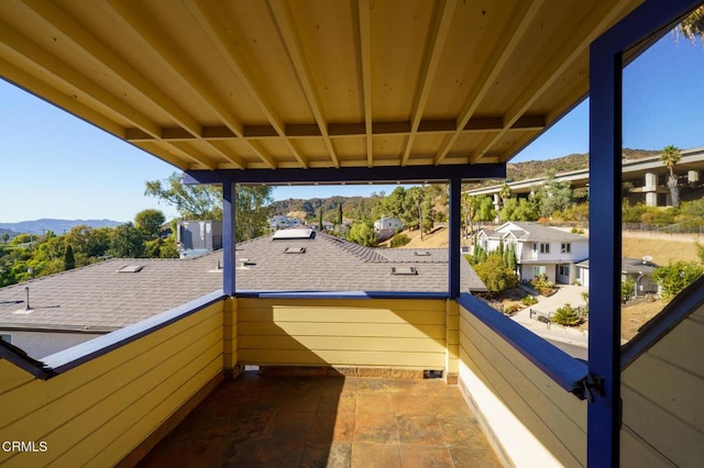 view of patio / terrace with a balcony and a mountain view