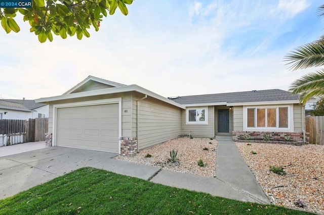 ranch-style house featuring a garage