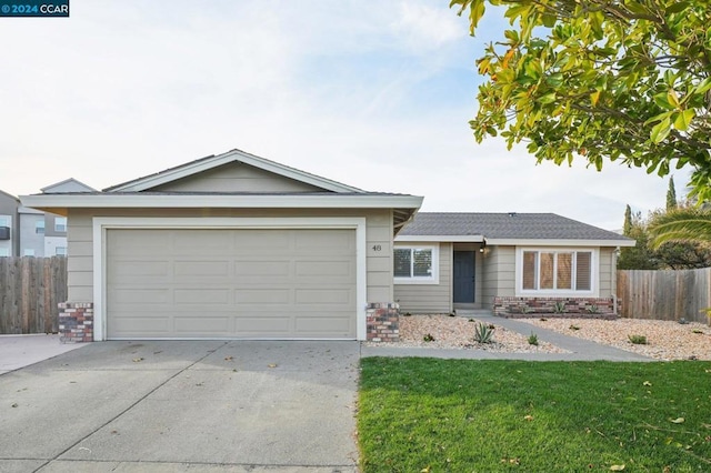 single story home with a garage and a front lawn