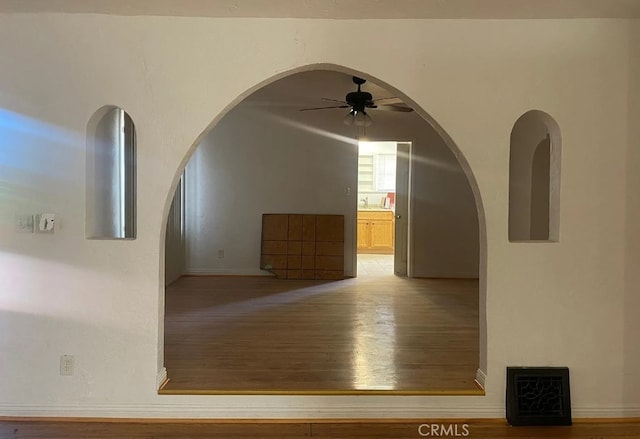 interior space featuring hardwood / wood-style floors and ceiling fan