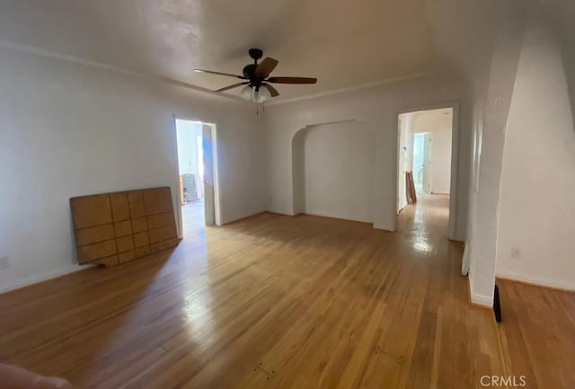 empty room with ceiling fan and light wood-type flooring