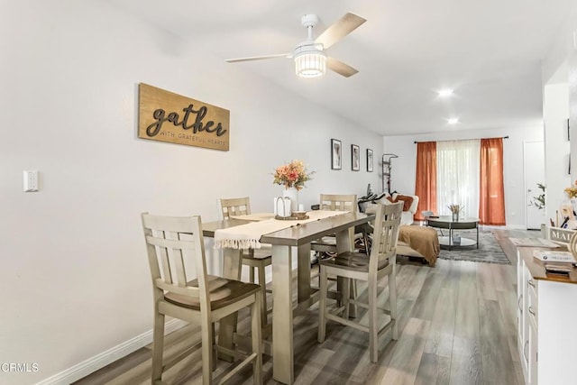 dining space featuring dark hardwood / wood-style floors and ceiling fan