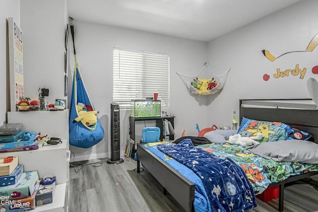 bedroom with wood-type flooring