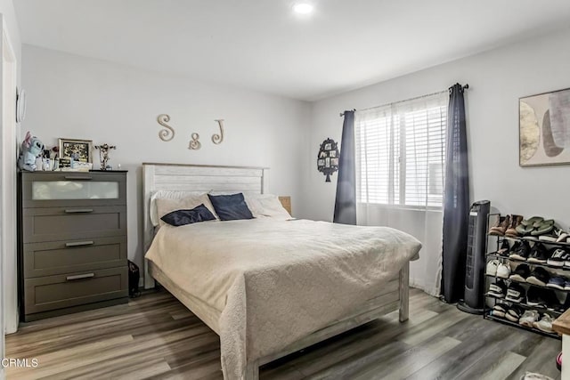 bedroom featuring dark wood-type flooring