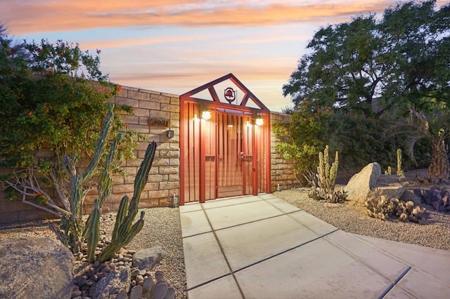 view of outdoor structure at dusk