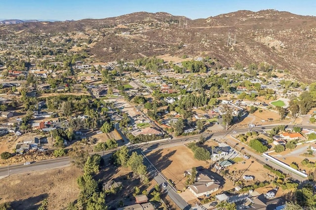 birds eye view of property with a mountain view