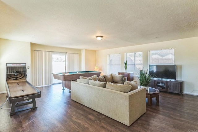 living room with a textured ceiling, dark hardwood / wood-style floors, and pool table