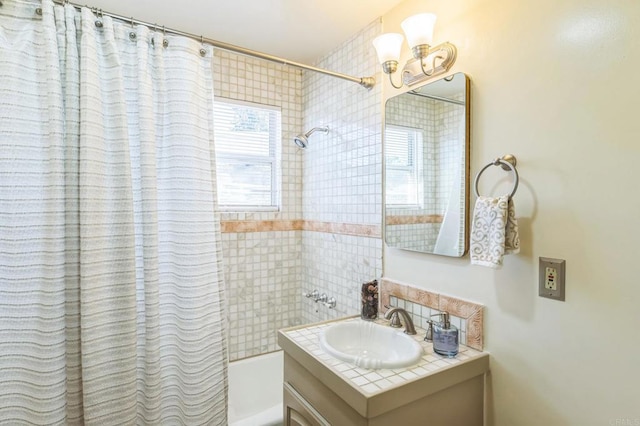 bathroom with shower / bath combo and vanity