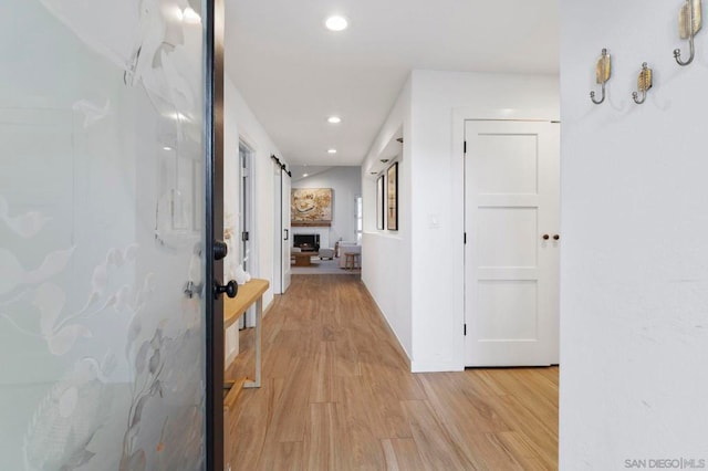 hallway with light wood-type flooring