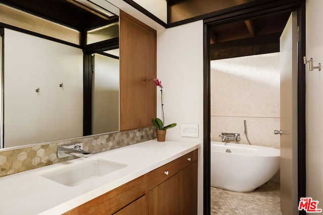 bathroom featuring decorative backsplash and vanity