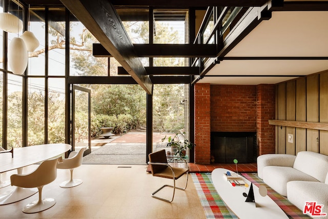 unfurnished sunroom with a fireplace