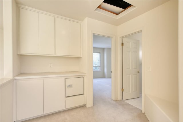 hallway featuring light carpet