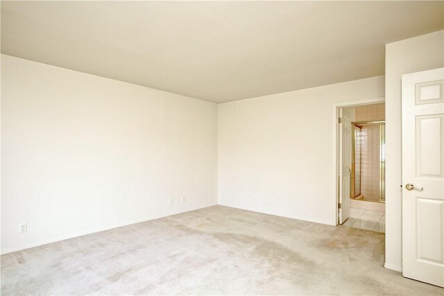 empty room featuring light colored carpet