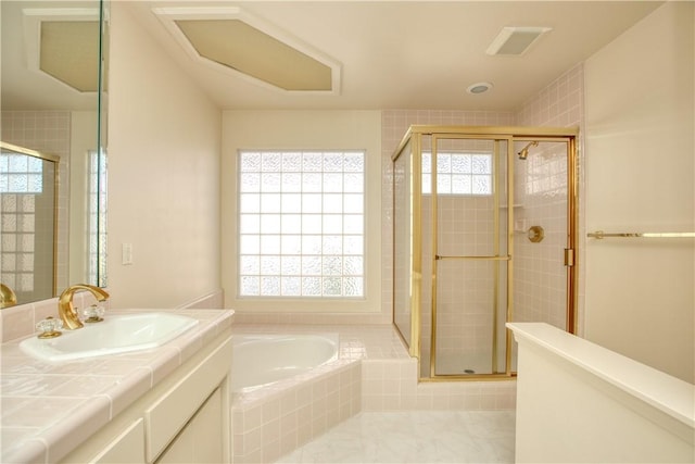 bathroom with tile patterned floors, vanity, and shower with separate bathtub