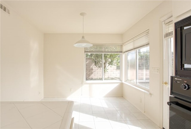 dining space featuring light tile patterned floors