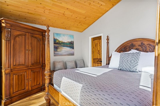 bedroom with wood ceiling, lofted ceiling, and light wood-type flooring