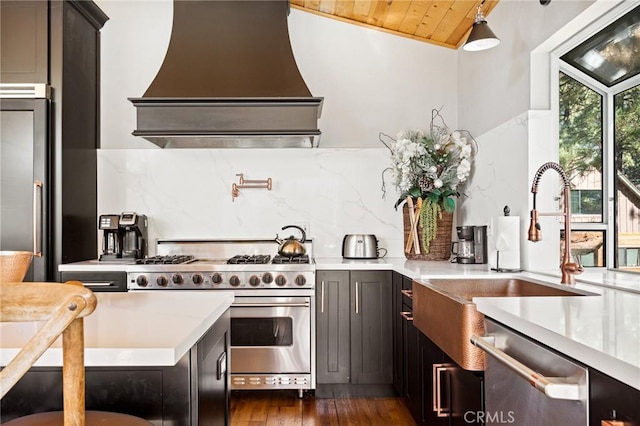 kitchen with dark hardwood / wood-style flooring, premium range hood, lofted ceiling, wood ceiling, and appliances with stainless steel finishes