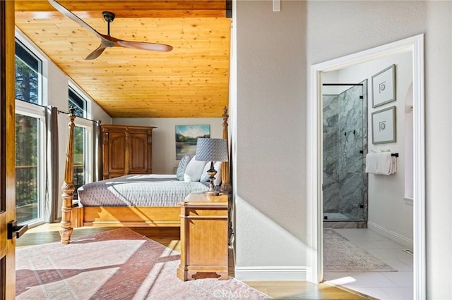 tiled bedroom with ceiling fan, wooden ceiling, and vaulted ceiling