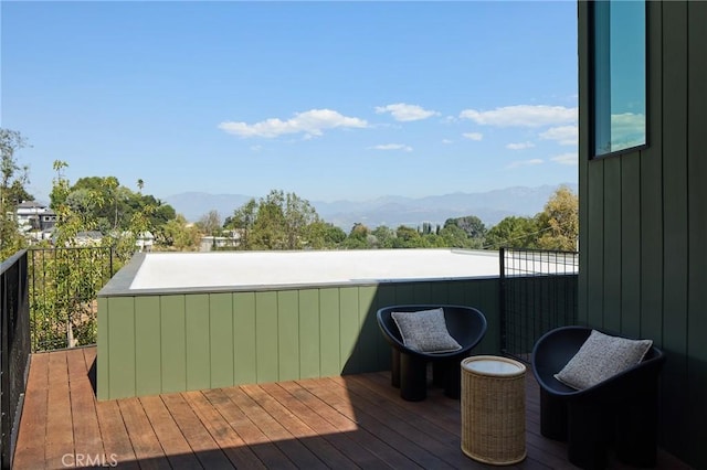 wooden terrace with a mountain view