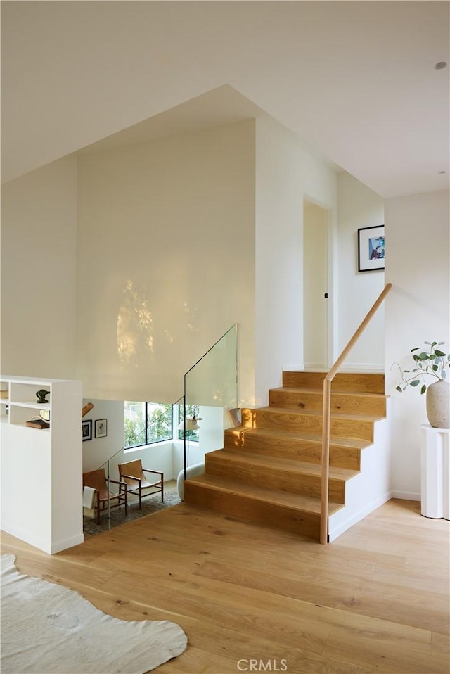 stairway with wood-type flooring