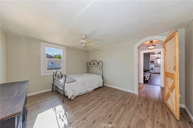 bedroom featuring hardwood / wood-style floors and ceiling fan