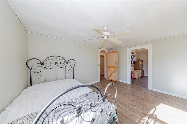 bedroom featuring light hardwood / wood-style flooring and ceiling fan