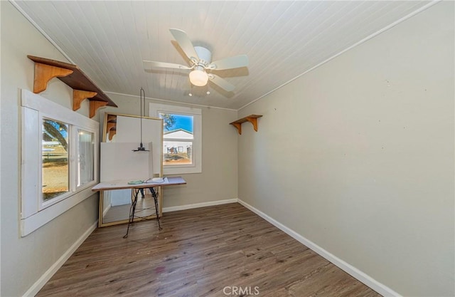 unfurnished room with wood-type flooring, ceiling fan, ornamental molding, and wood ceiling