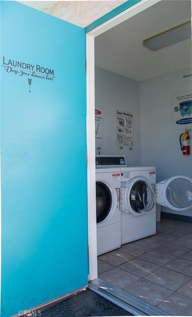 washroom with washing machine and dryer