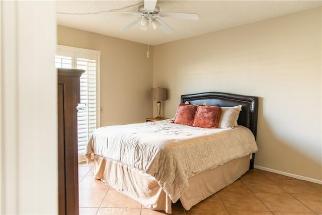 bedroom featuring ceiling fan and light tile patterned floors