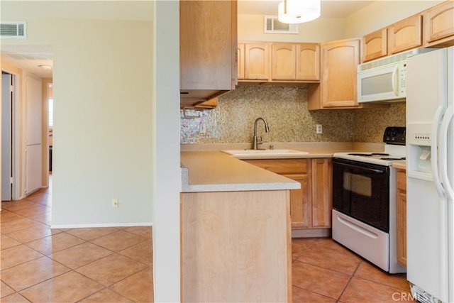 kitchen with sink, white appliances, decorative backsplash, light brown cabinetry, and light tile patterned floors