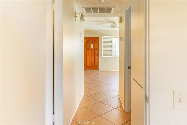 hallway featuring light tile patterned flooring