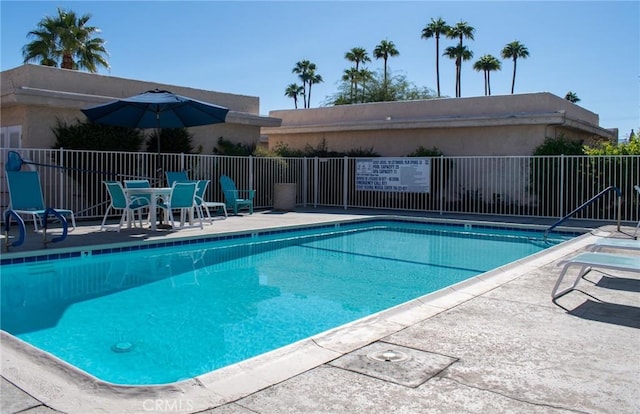 view of pool featuring a patio