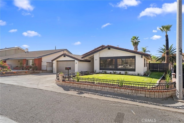 ranch-style home with a front yard and a garage