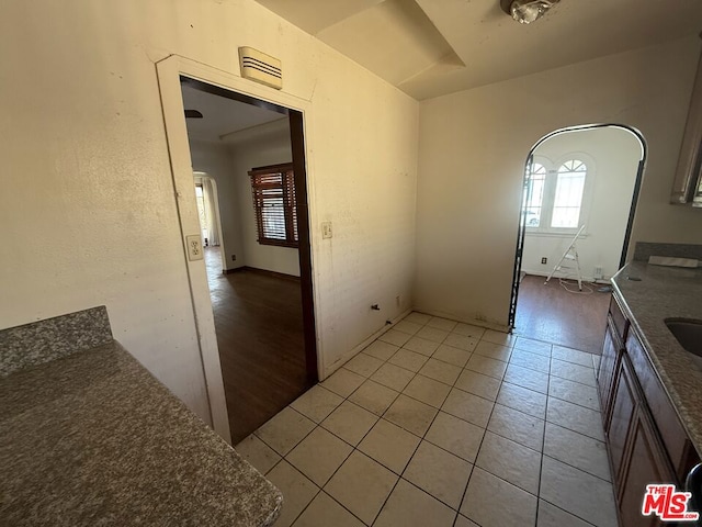 interior space featuring light tile patterned floors