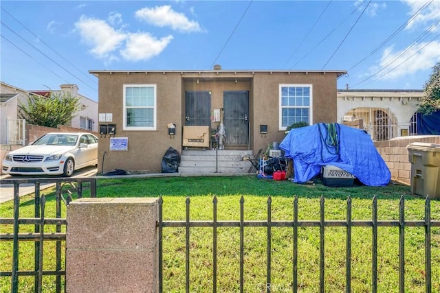 view of front facade with a front lawn