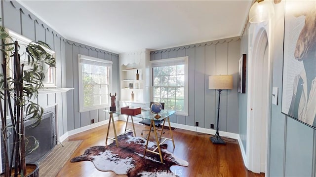 office with ornamental molding and wood-type flooring