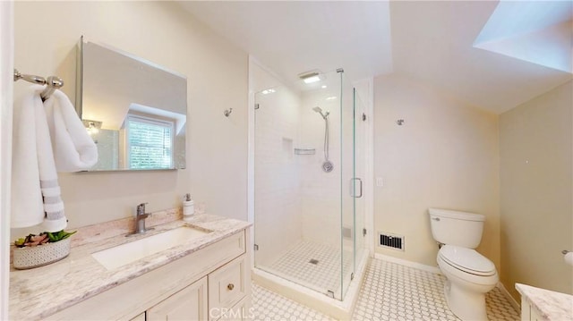 bathroom featuring toilet, a shower with door, and vanity