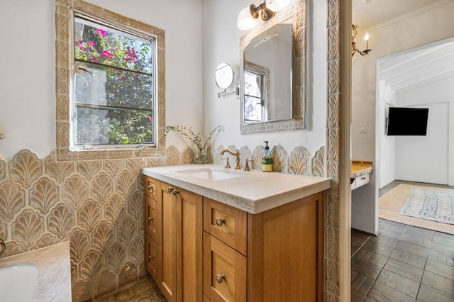 bathroom featuring vanity, a bath, crown molding, and tile walls