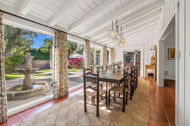 sunroom / solarium with a notable chandelier, vaulted ceiling with beams, and wood ceiling