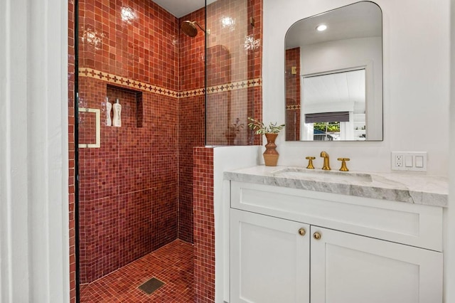 bathroom with vanity and walk in shower