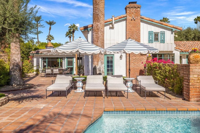 rear view of house featuring a patio