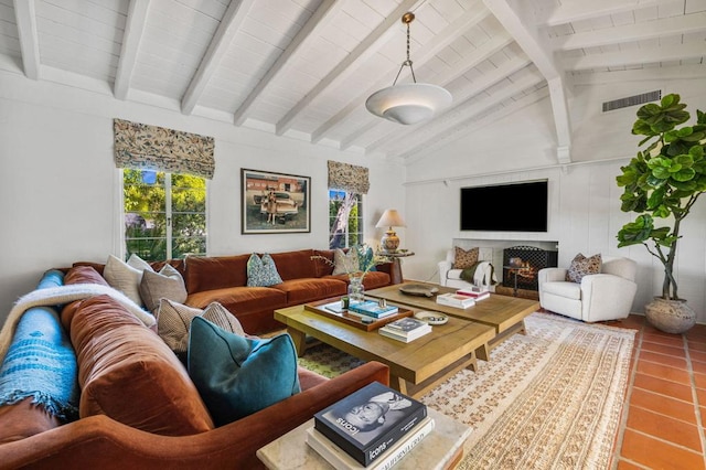 tiled living room with lofted ceiling with beams