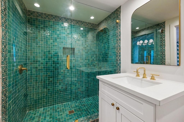 bathroom featuring vanity and a shower with shower door